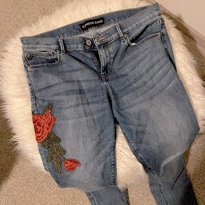 Express, skinny, mid rise appliqué jeans.